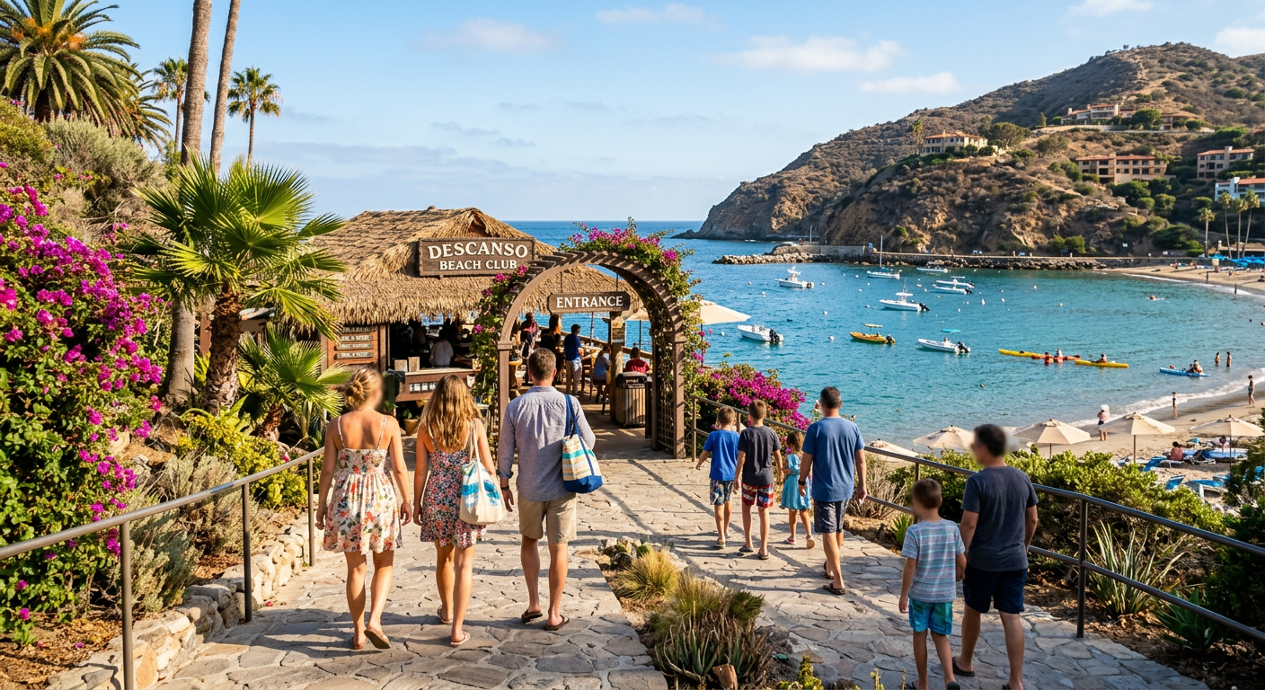 Tourists walking along the paved coastal path toward the beach club entrance on Catalina Island